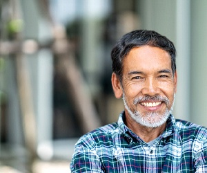 An older man smiling